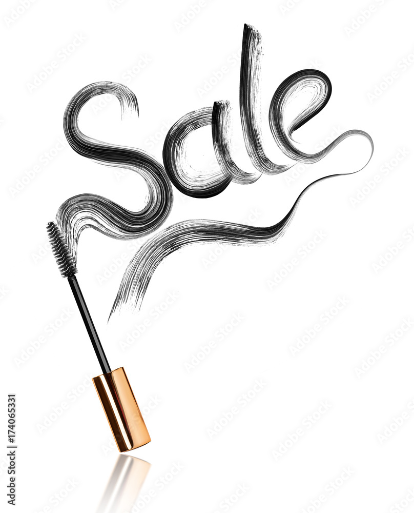 Inscription Sale written with mascara smears close-up, isolated on white background