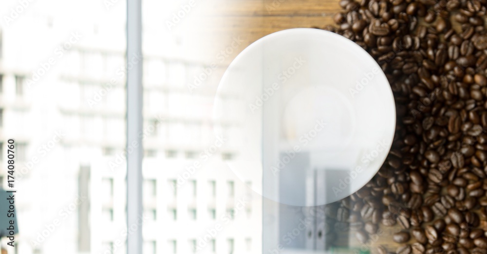 Overhead of coffee cup with beans and blurry window transition