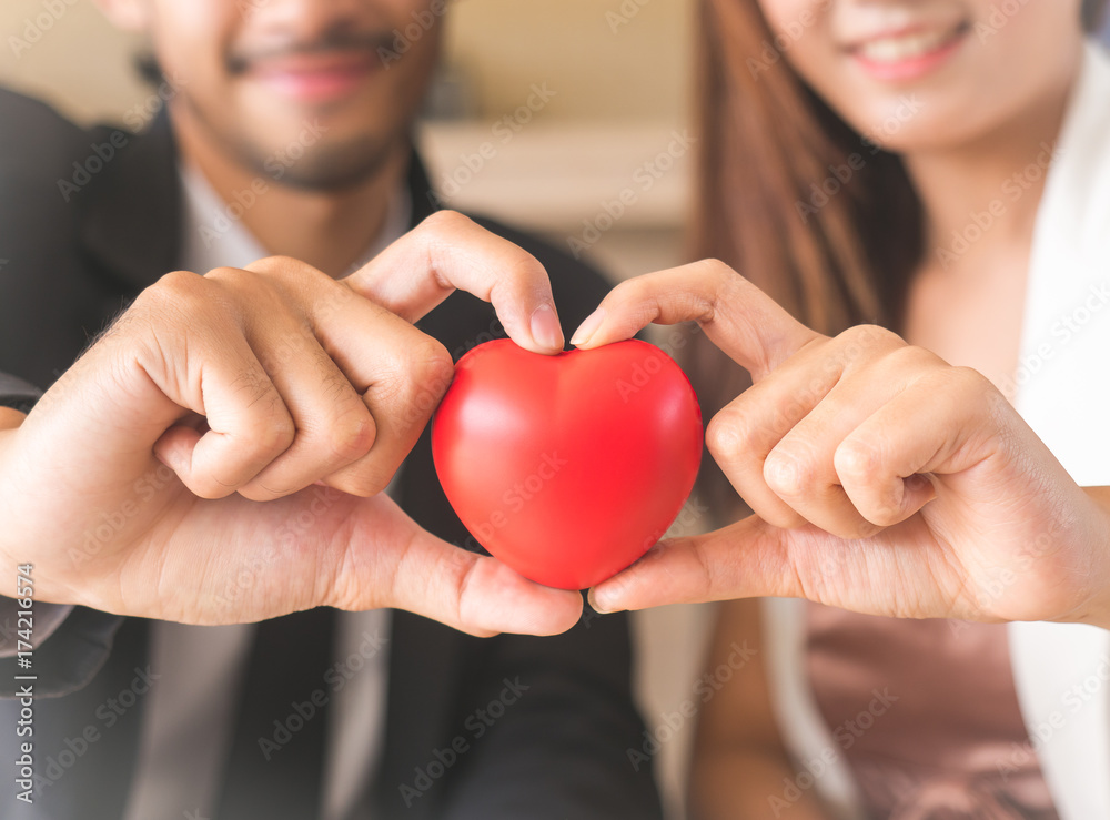 love couple holding red heart for loving, wedding, valentine concept