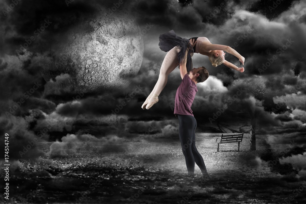 Composite image of man holding ballerina 