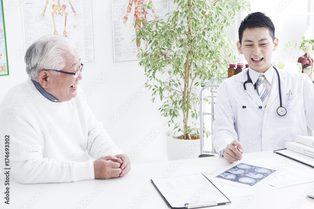 Young doctor who talks happily with patient