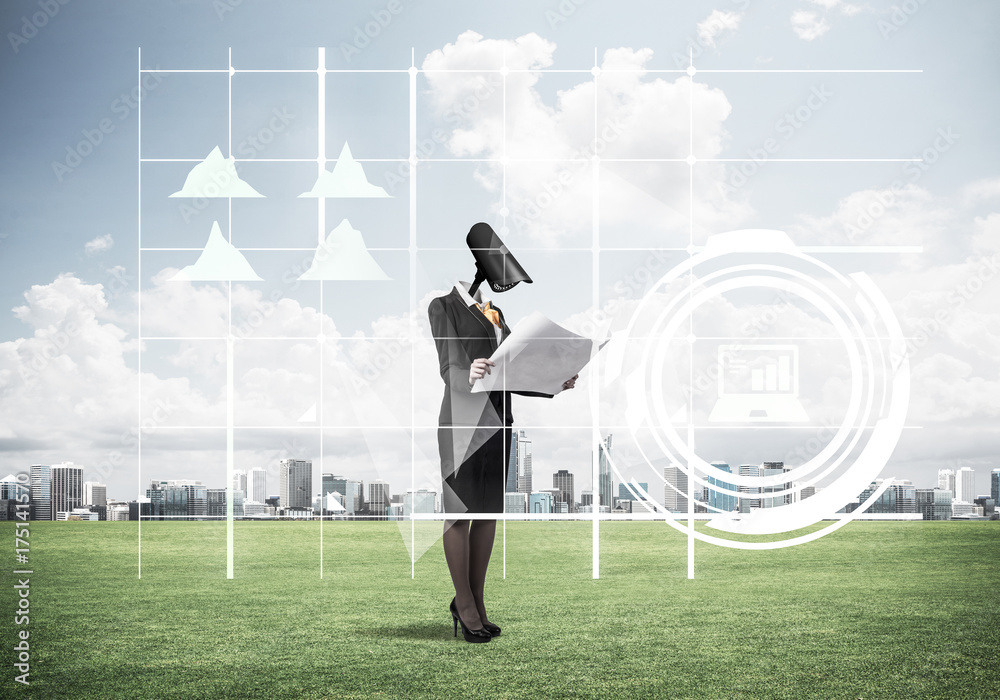 Camera headed woman standing on green grass against modern citys