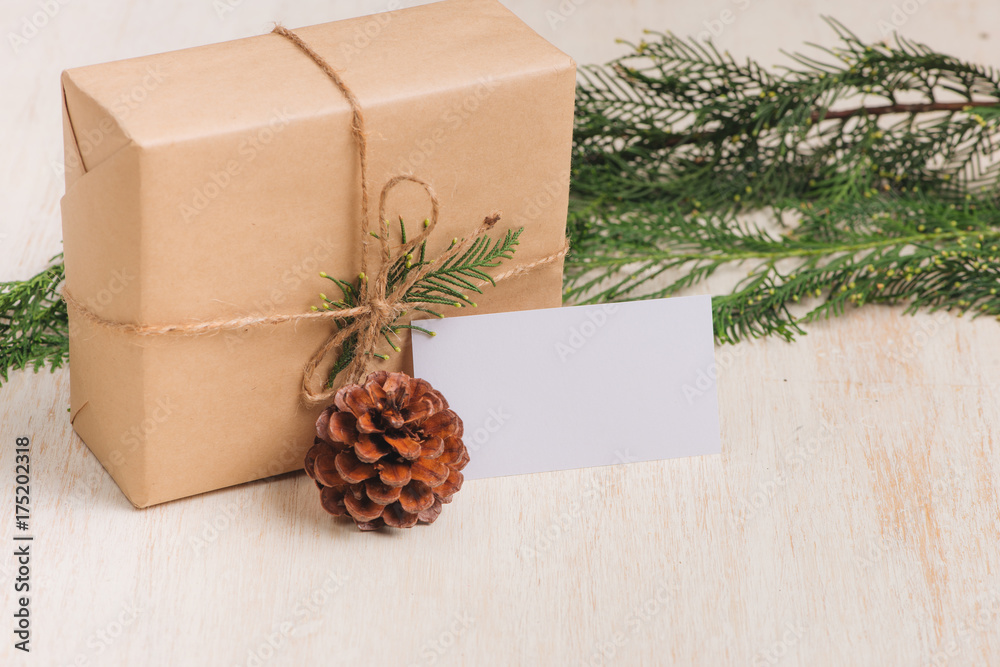 Christmas or New year gift boxes collection wrapped in kraft paper on wood background.