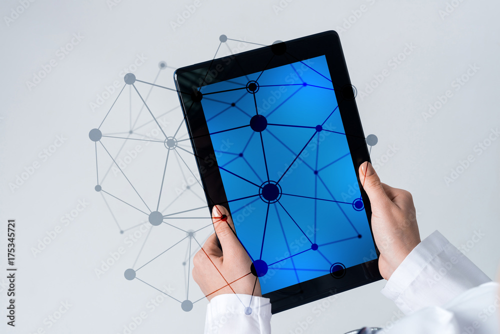 Close of female doctor hands working with tablet pc computer