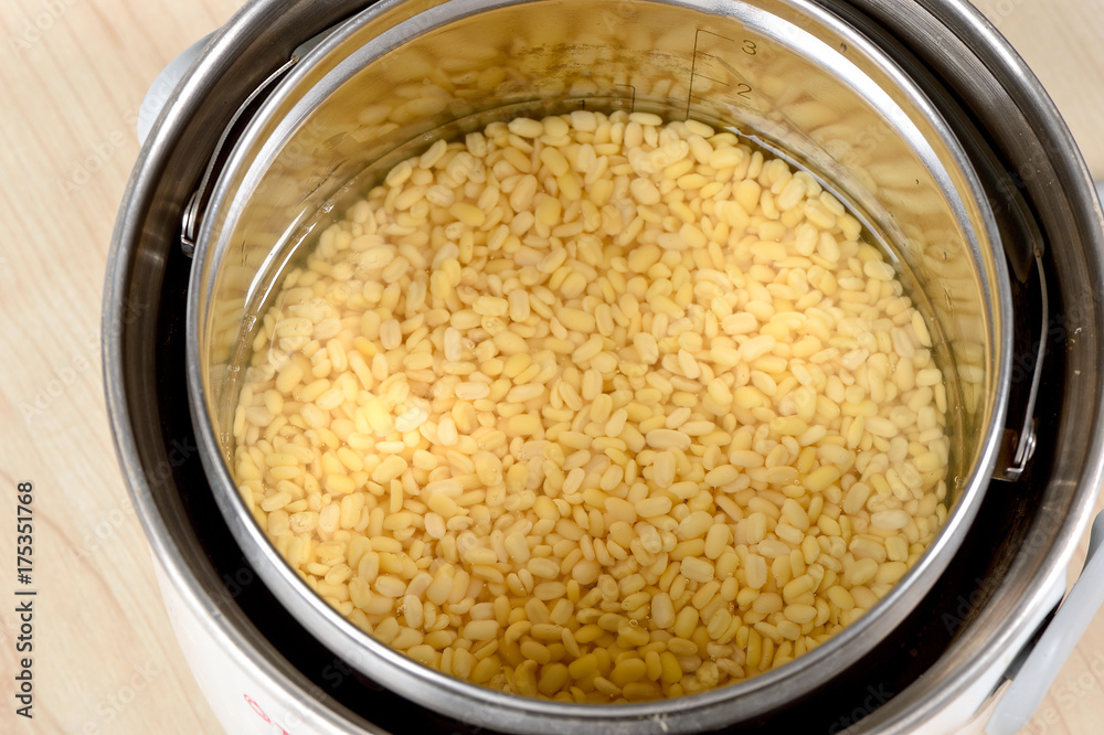 mung bean in electric pot on wooden table