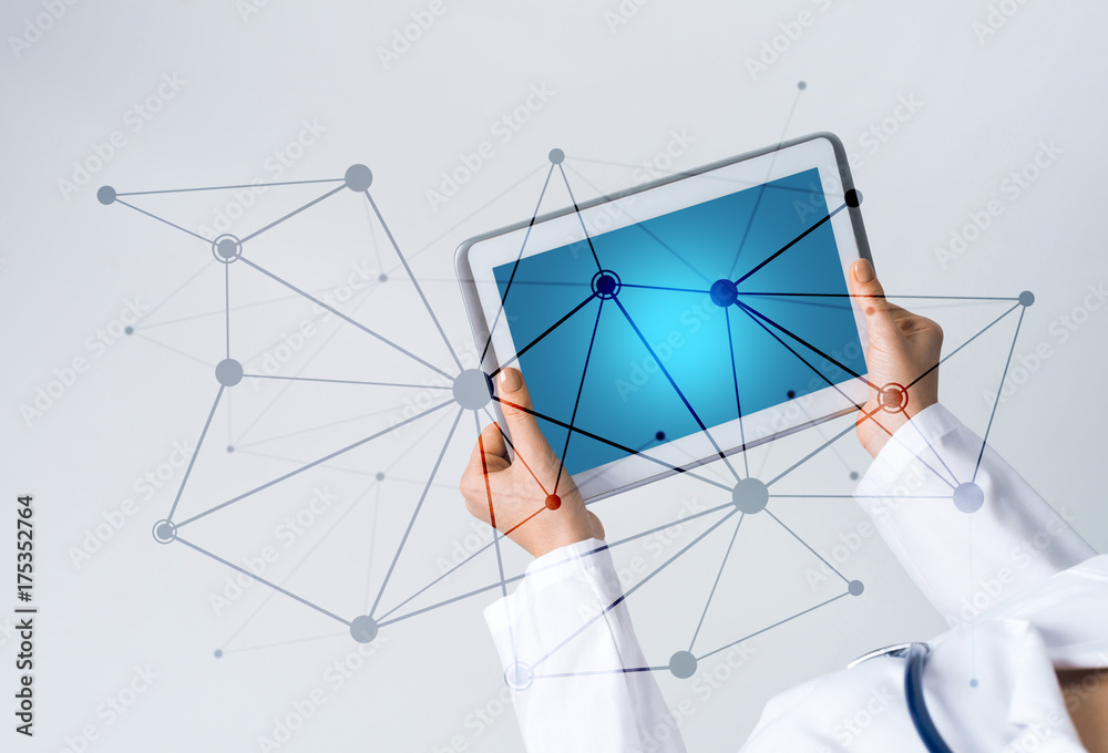 Close of female doctor hands working with tablet pc computer