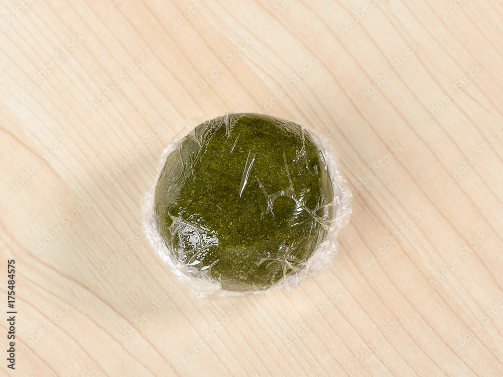 Matcha powder dough on wooden table