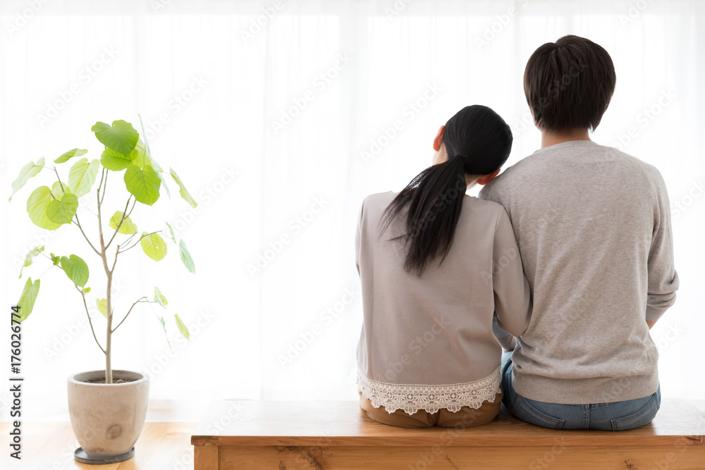 young asian couple in living room