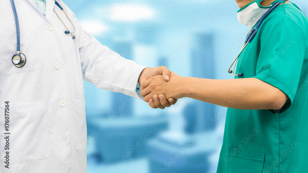 Doctors shaking hands. Medical people teamwork.