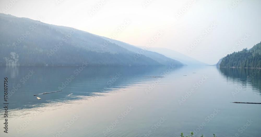 River amidst mountains against sky