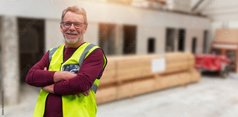 Composite image of confident senior worker with arms crossed