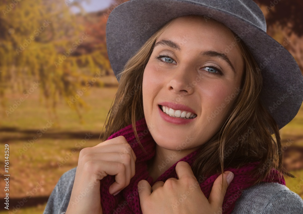 Woman in Autumn with hat and scarf in nature park