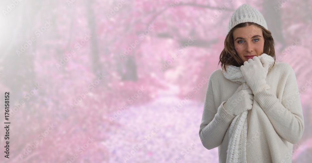 Woman in Autumn with hat and scarf in bright pink forest