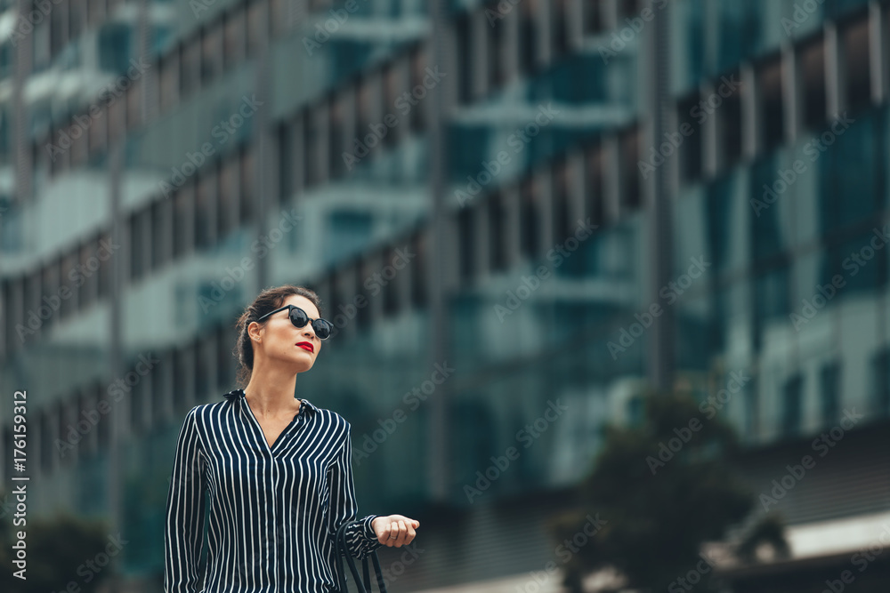 Business woman in front of urban building