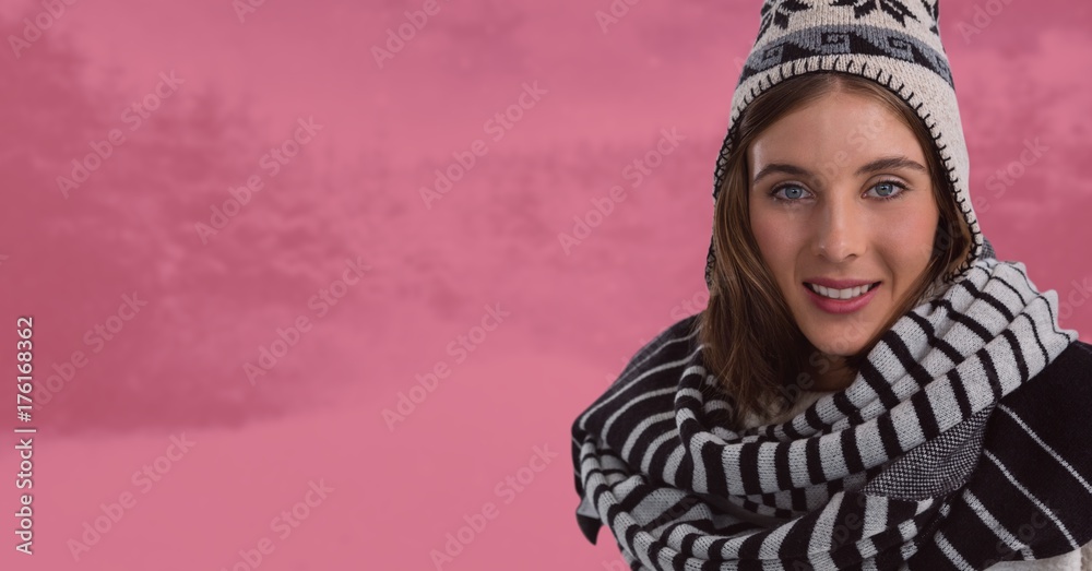 Woman with scarf and hat in pink toned snow forest at night