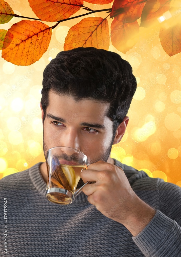 Man drinking tea with Autumn leaves background