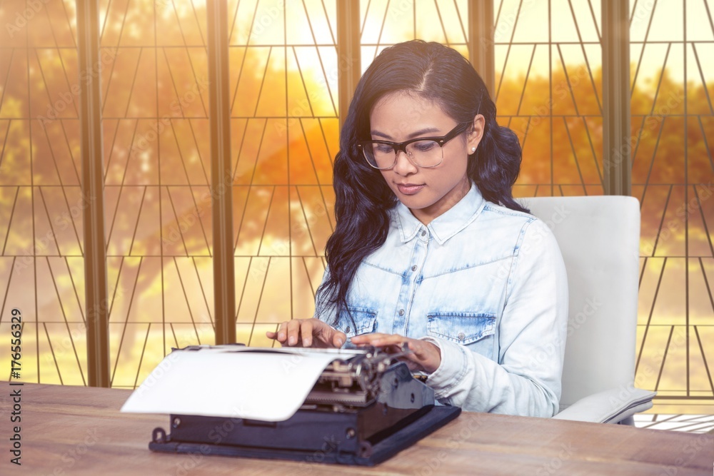 Composite image of asian woman typewriting