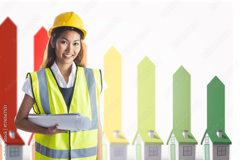 Composite image of architect woman with yellow helmet and plans