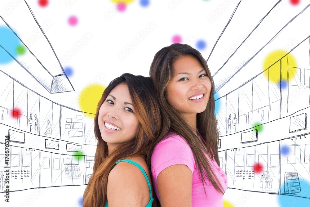 Composite image of two beautiful girls posing for the camera 