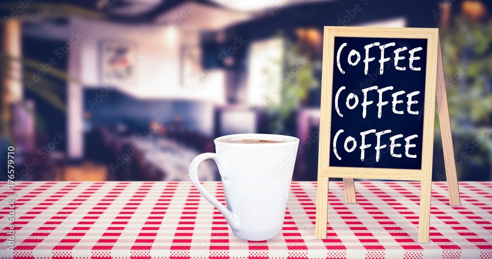 Composite image of cup of coffee on table 