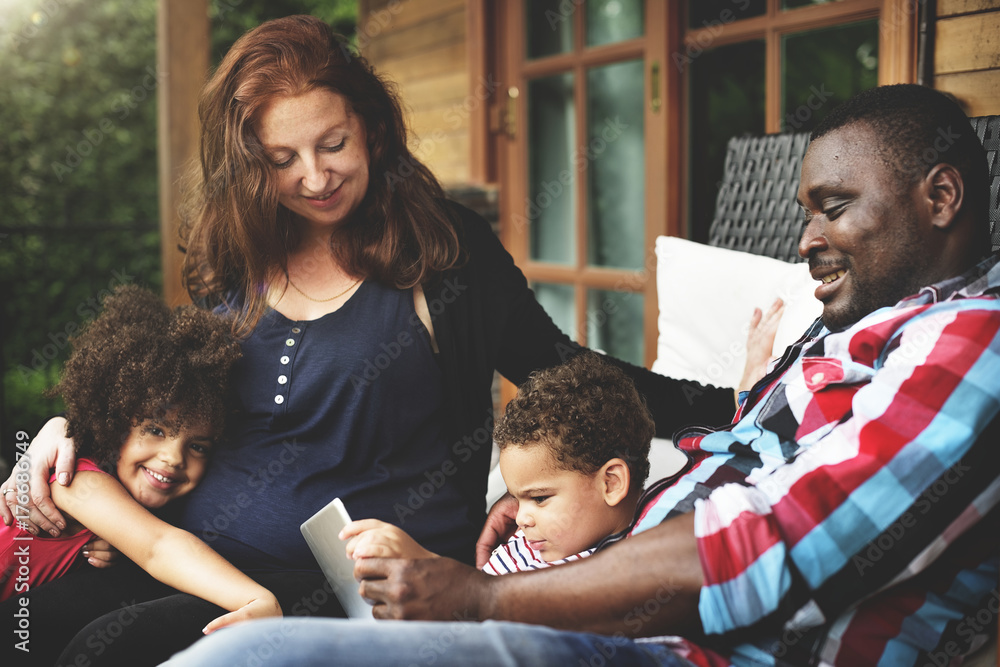 Mixed race family having fun together