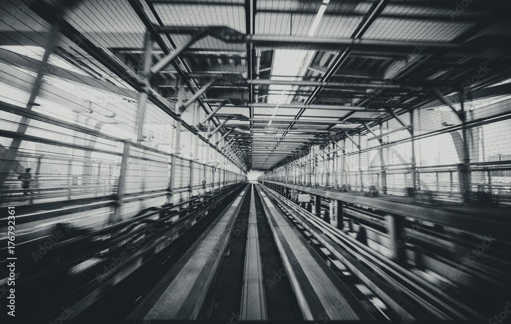 Train moving on city rail with motion blur