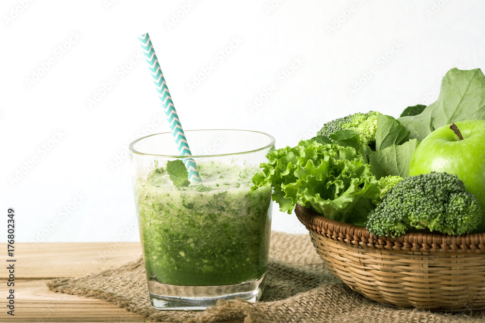 close up a green apple with mixed green vegetable and green juice  for healthy organic green food co