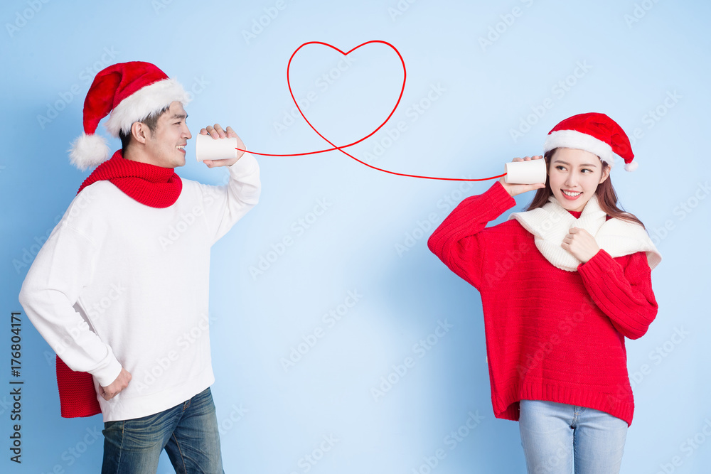 couple smile with merry christmas