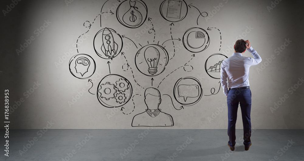 Businessman watching a project sketch on a wall 3D rendering