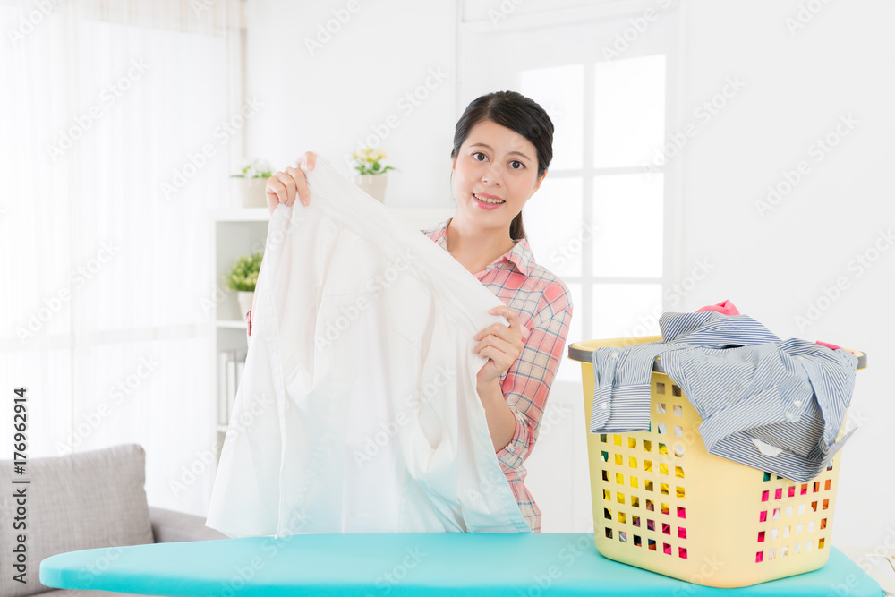 smiling attractive woman holding white shirt