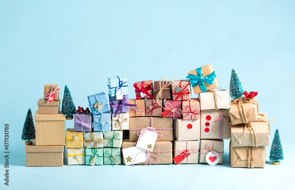 Collection of Christmas present boxes on a light blue background