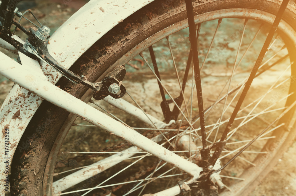 close up old bicycle wheel with sunshine