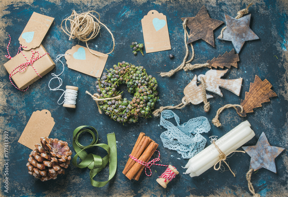 Preparing for Christmas. Christmas related objects on shabby table background, top view. Holiday wre