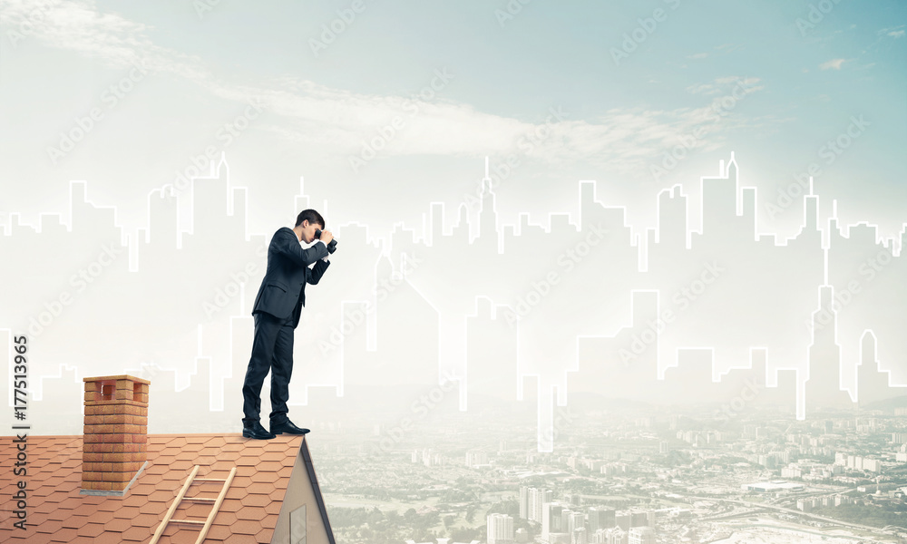 Businessman standing on roof and looking in binoculars. Mixed me