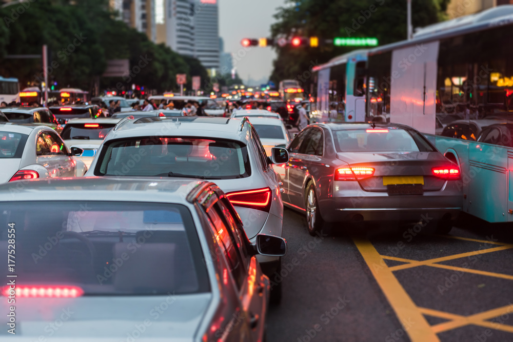 traffic jam on main street with row of cars