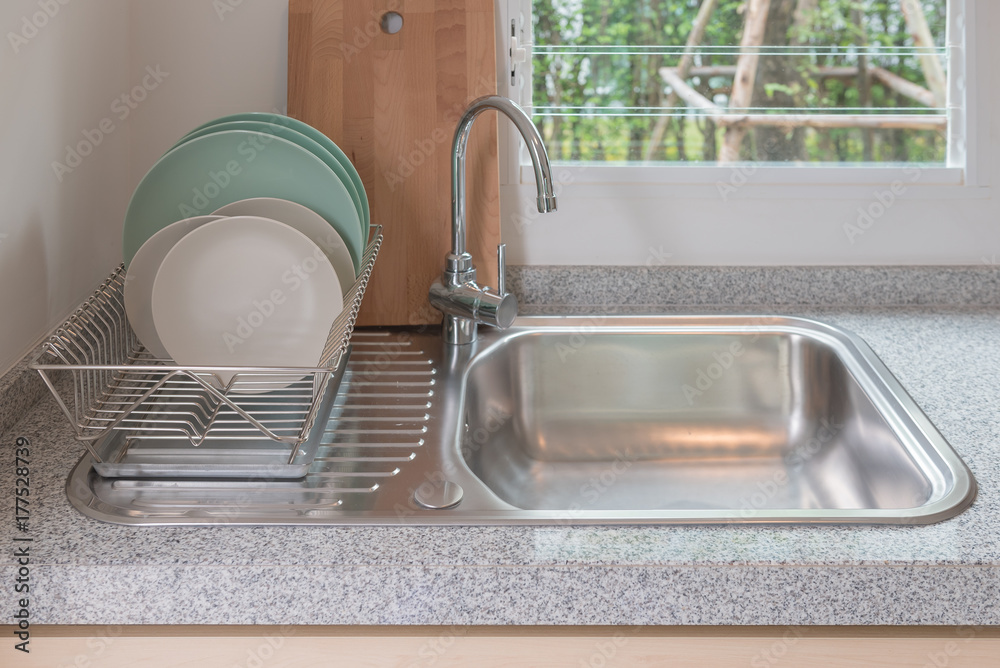 modern kitchen room with sink on counter