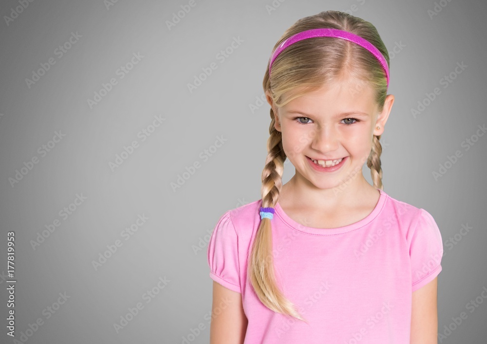 Girl against grey background with braided hair