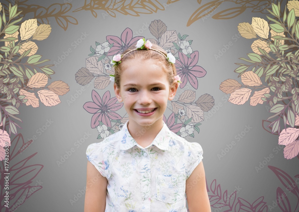 Girl against grey background with flowers in hair and pretty