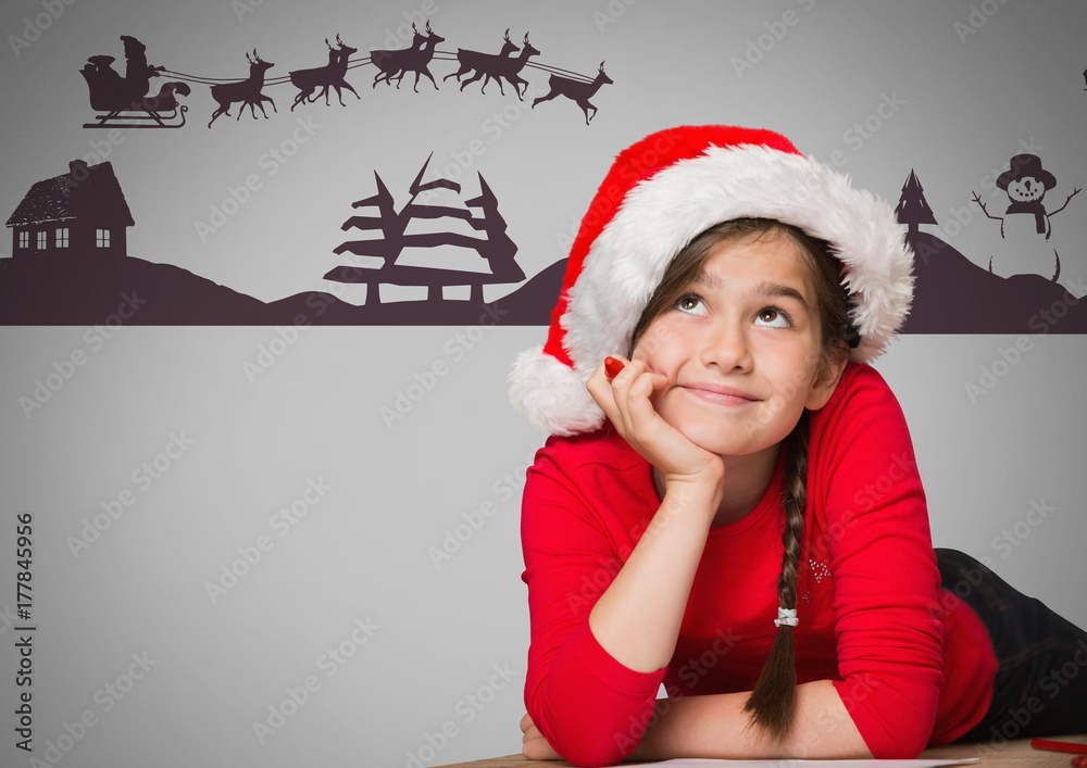 Girl against grey background with Santa Christmas hat and hair