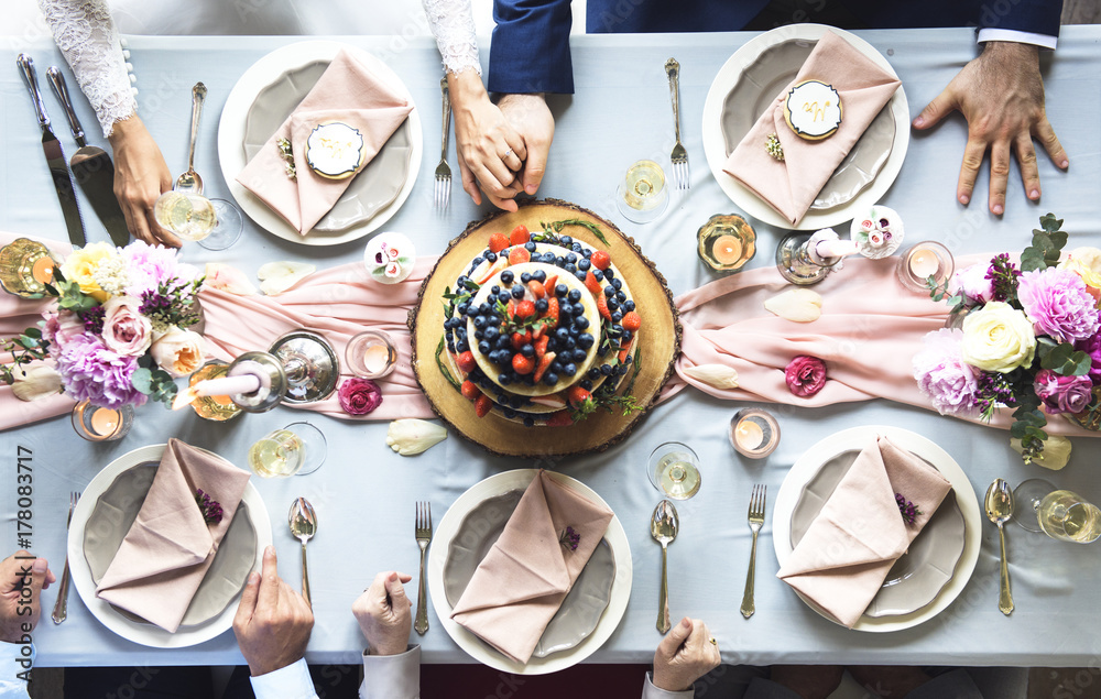 Aerial view of fruity wedding cake on wedding reception table