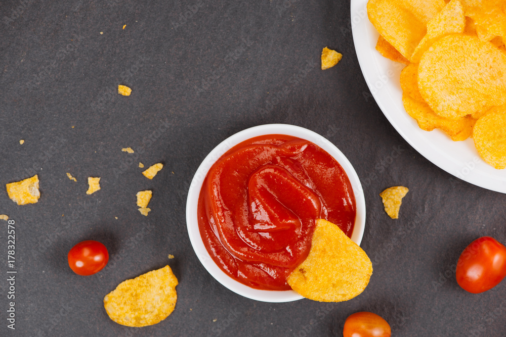 Potato chips and ketchup. Beer snack, unhealthy eating