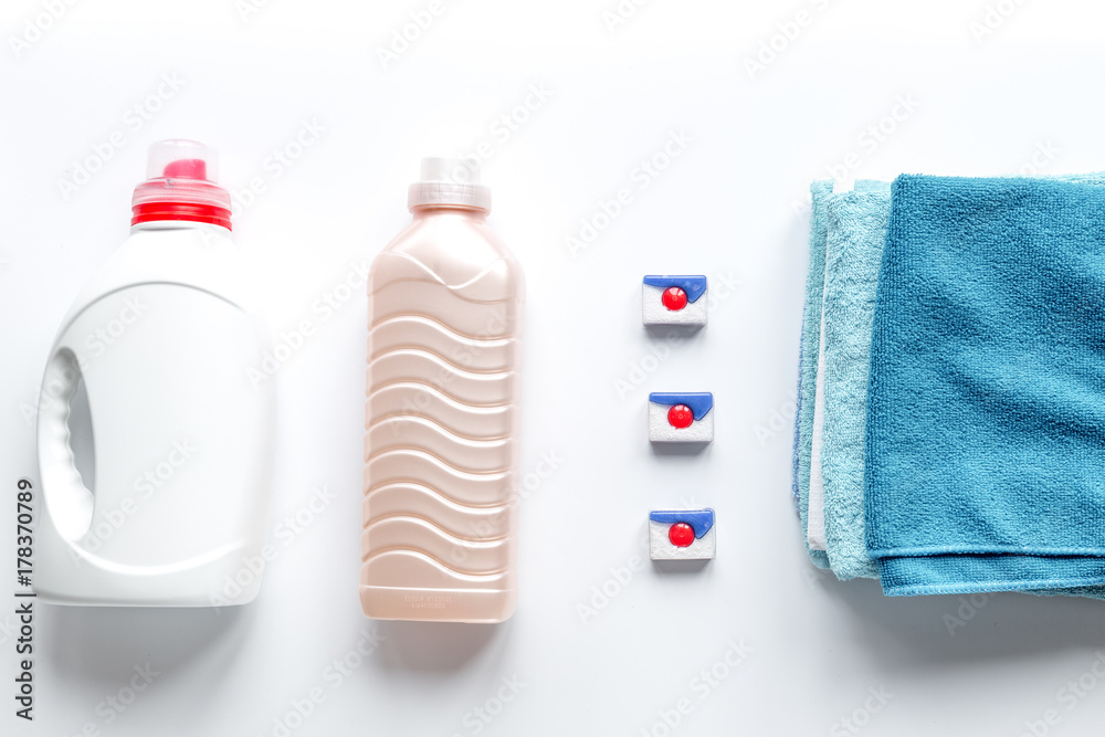 housekeeping set with towels and plastic bottles in laundry top 