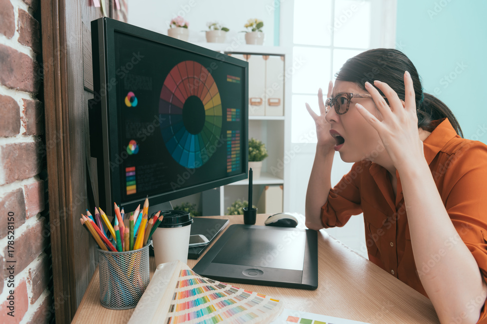 professional woman designer looking at screen