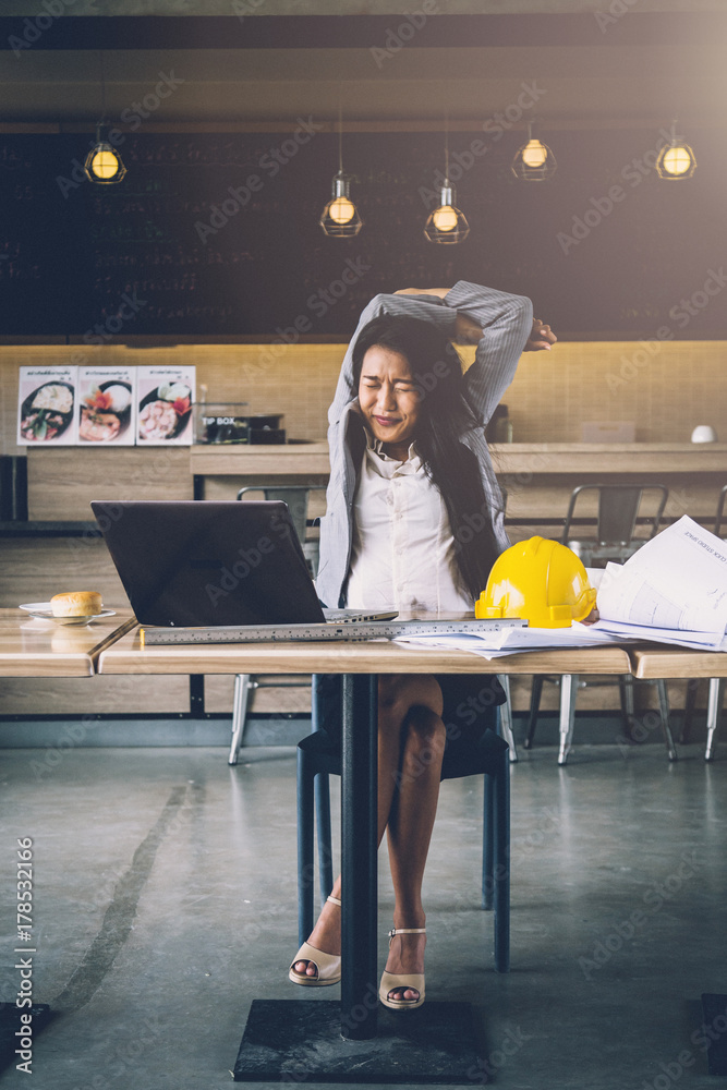 lazy freelance asian business girl with boring working moment with cafe background