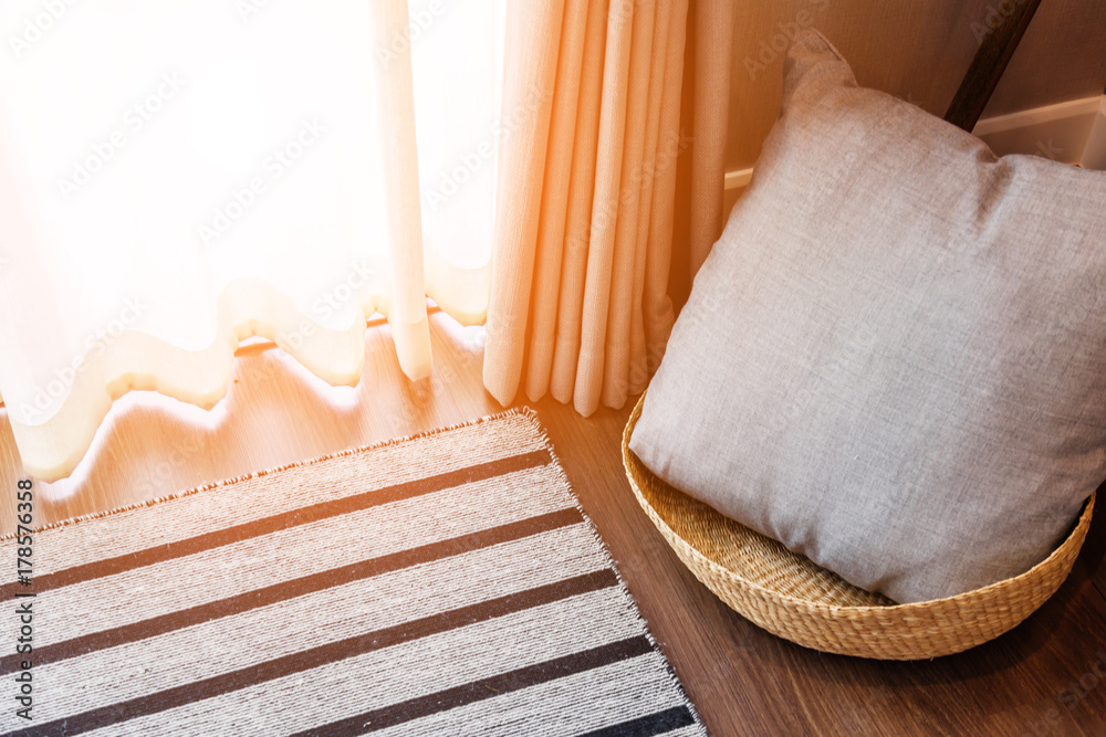 pillow in rattan basket with window background