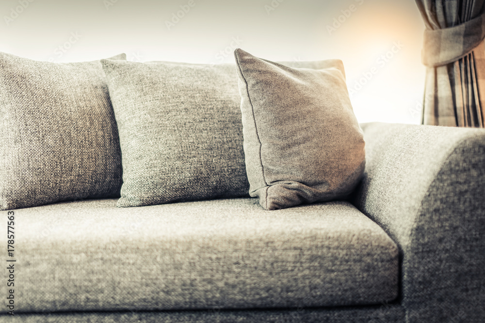 contemporary interior of Living room with part of sofa in sunny day and white curtain interior backg