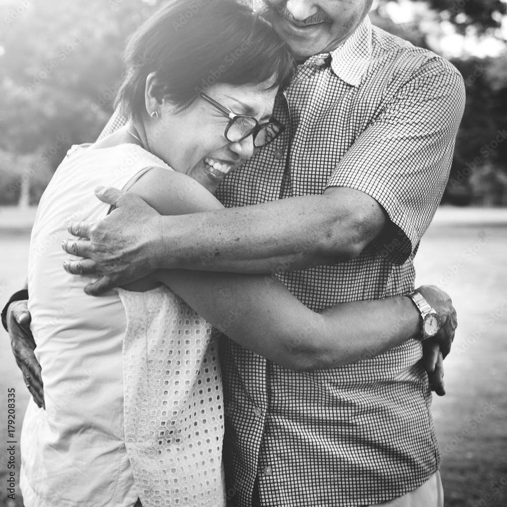 Senior Asian couple hugging each other