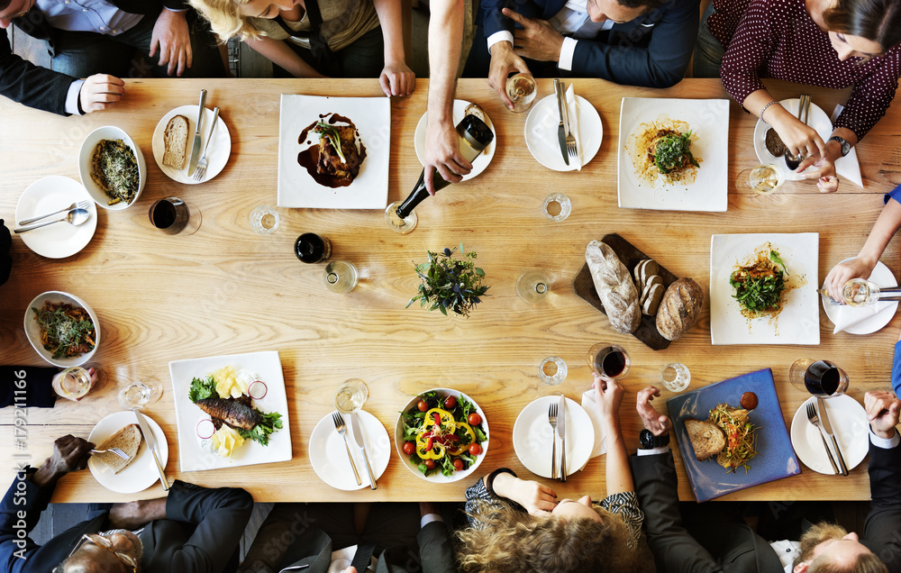 Group of diverse people are having lunch together