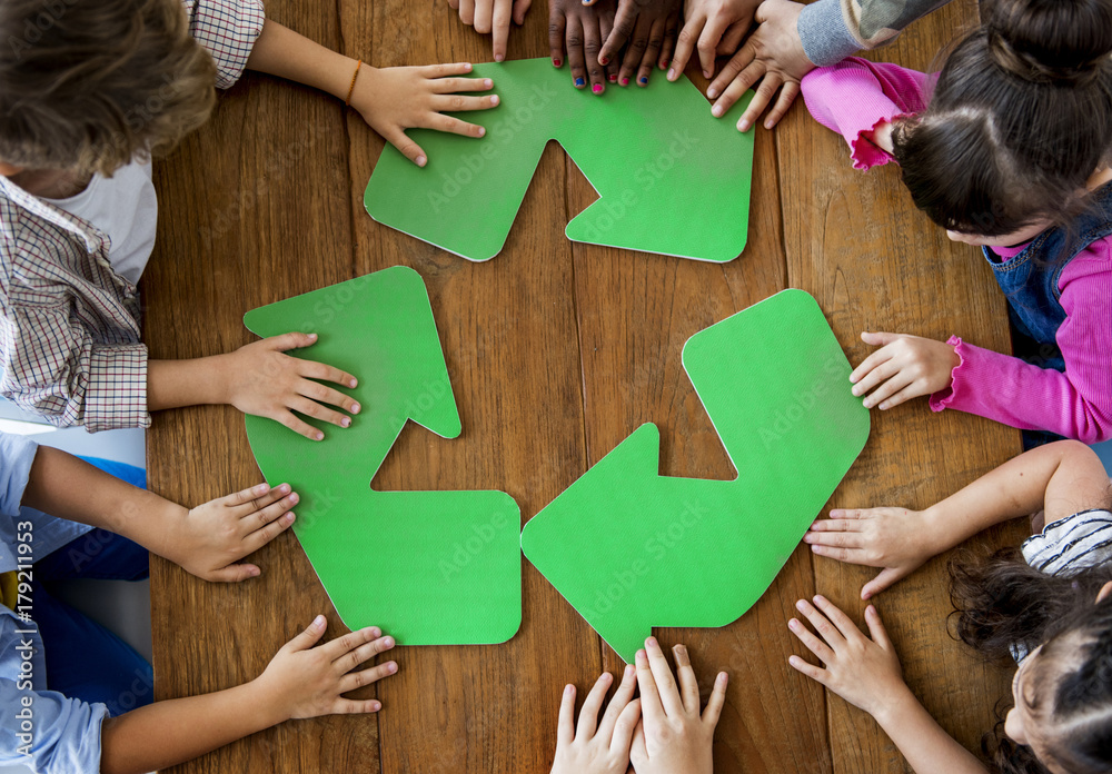 A group of primary schoolers learning about recycling