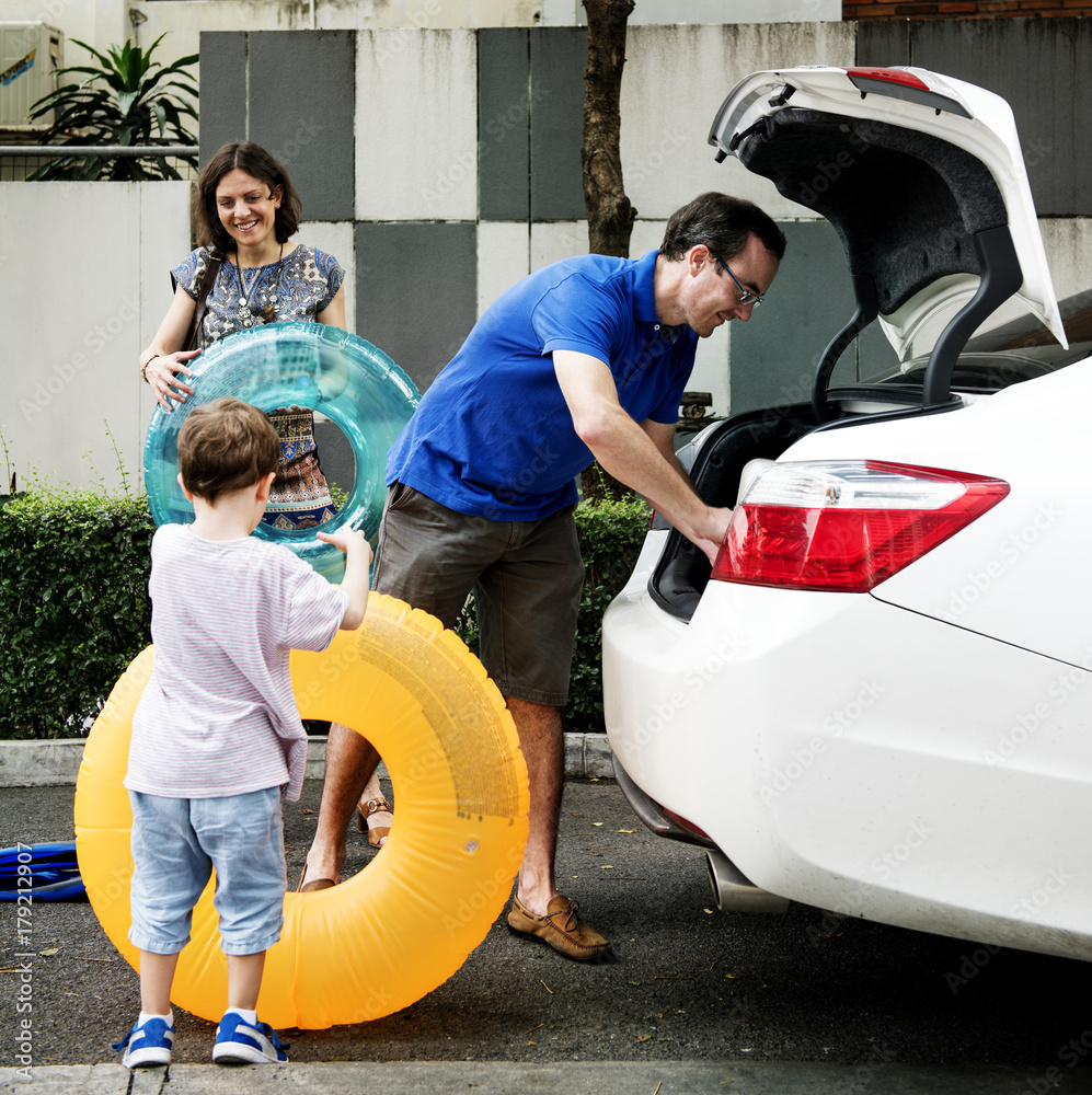 Family packing for a summer vacation